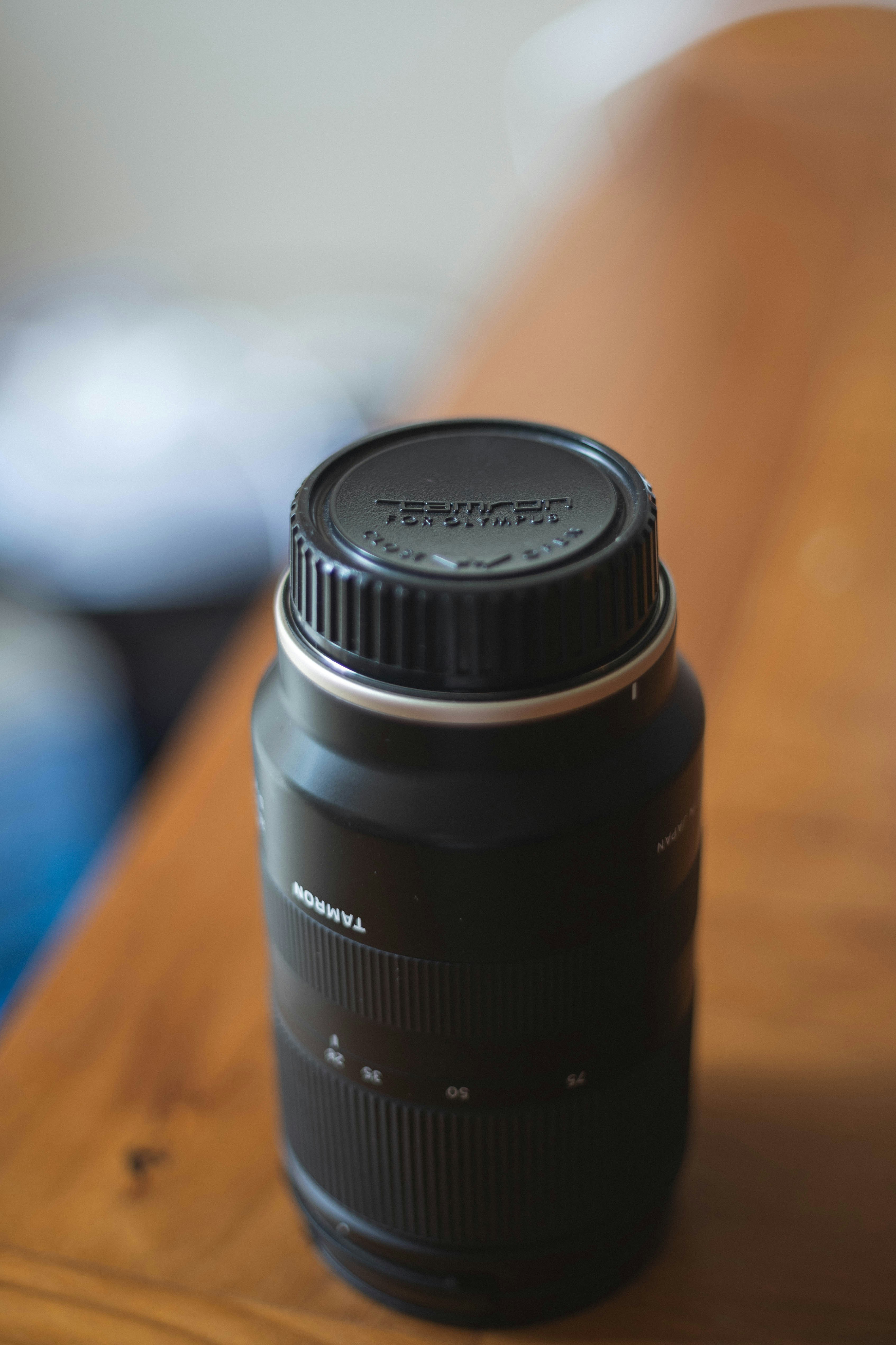black camera lens on edge of table